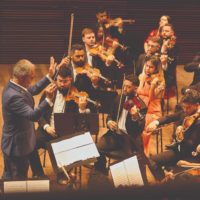 Orquestra Sinfônica Heliópolis se apresenta sob regência do maestro Edilson Ventureli durante a cerimônia de abertura do Teatro Baccarelli.